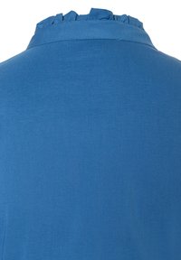 Blue blouse with a ruffled collar, made of smooth fabric, featuring a simple design and uniform texture, seen from the back.