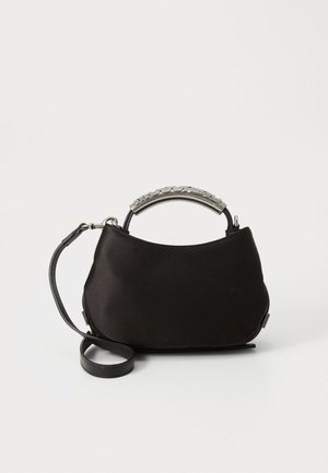 Black satin handbag with a curved silver handle and a detachable black strap. Soft texture and rounded shape with minimalistic design.