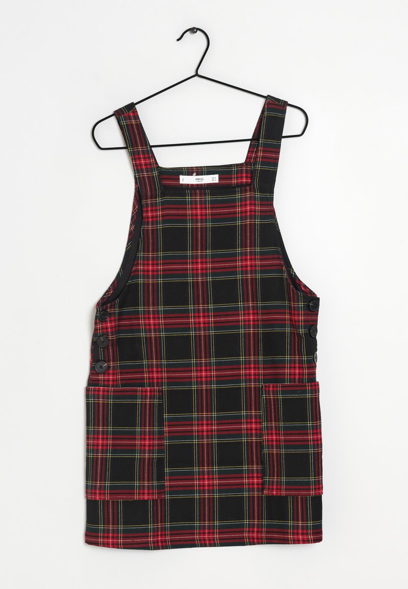 Schwarzes und rotes karierter Latzkleid mit grünen Akzenten, breiten Trägern, zwei Fronttaschen und seitlichen Knopfverschlüssen.