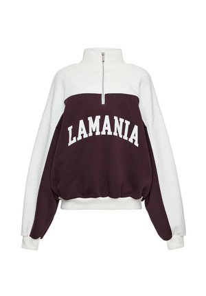 Biała i ciemnoczerwona bluza z półgolfem na zamek, długimi rękawami, elastycznymi mankietami i dołem oraz napisem "LAMANIA" na piersi.