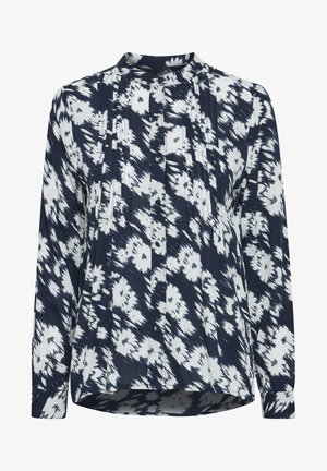 Jūras spēku un baltā blūze ar rakstu dizainu, ar krokām priekšpusē, garām piedurknēm un daļēji stāvošu apkakli. Pogājamais aizdare gar priekšpusi.