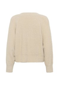 Beżowy sweter o miękkiej, puszystej fakturze. Posiada luźny krój, długie rękawy i prążkowany dół. Delikatne, błyszczące akcenty w całej dzianinie.
