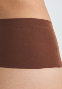 Spanx SPANXSUPERSMOOTH™ UNDIE-TECTABLE® THONG - String - hickory