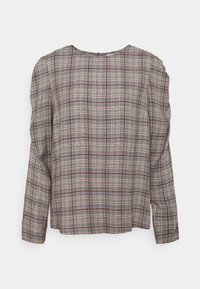 Chemise à manches longues en beige, marine et bordeaux. Elle présente un col rond et un tissu doux et texturé. Coupe décontractée avec des épaules froncées.