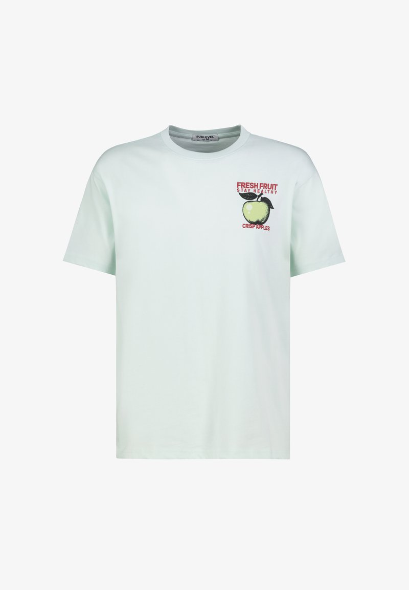 Light blue short-sleeve T-shirt with a green apple graphic and red text "FRESH FRUIT STAY HEALTHY CRISP APPLES" on the left chest.