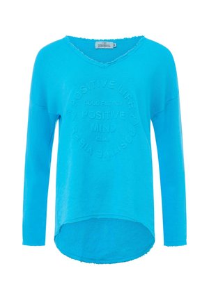 Turquoise long-sleeve top with a V-neck, featuring embossed text: "POSITIVE LIFE, POSITIVE MIND, GOOD ENERGY" in a circular pattern.