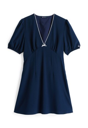 Abito blu navy in un tessuto morbido, con maniche a sbuffo, scollo a V con bordatura bianca e un fiocco decorativo sulla parte frontale.