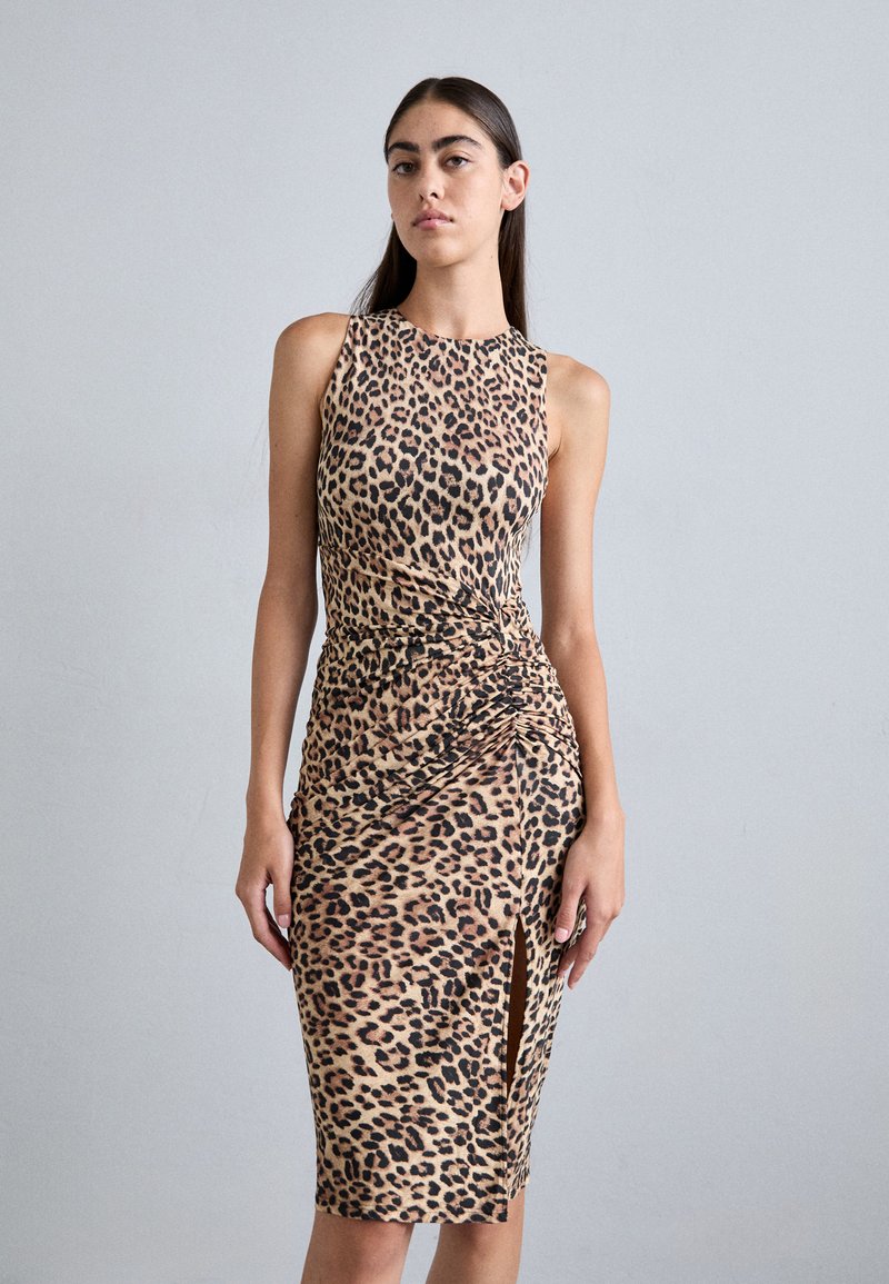 Leopard print dress, sleeveless, form-fitting, knee-length with a side slit. Made from smooth fabric with a gathered waist detail.