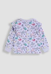 Top de manga larga en color lila con un patrón de dinosaurios y flores, con hombros rizados y mangas acampanadas para un ajuste ceñido.