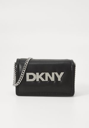 Black leather clutch featuring a silver chain strap and prominent silver "DKNY" logo. Smooth texture with clean lines and minimalistic design.