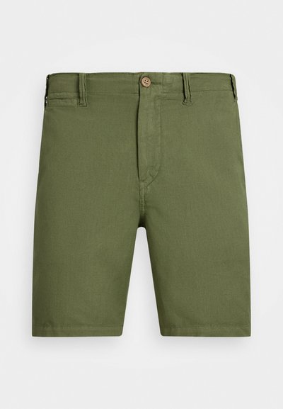 Olive roheline lühike püksid, valmistatud kergest kangast, nuppude sulgemisega, vöökeste ja sirge lõikega põlve pikkuses.