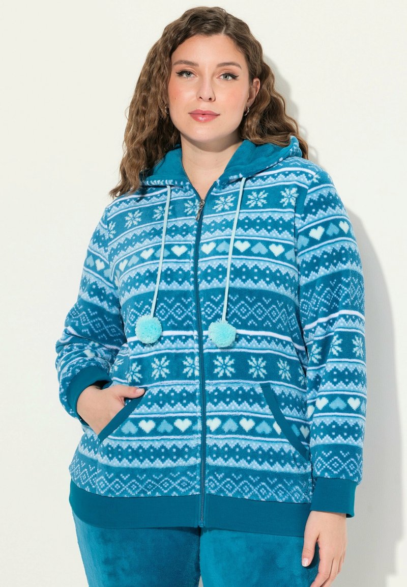 Felpa verde acqua con zip in morbido pile, presenta intricati motivi a fiocco di neve e cuori, con due pompon sulle stringhe di serraggio e tasche.