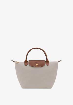 Grey nylon tote bag with a brown leather flap and handle, gold hardware, and a spacious, structured design. Reinforced stitching accents.