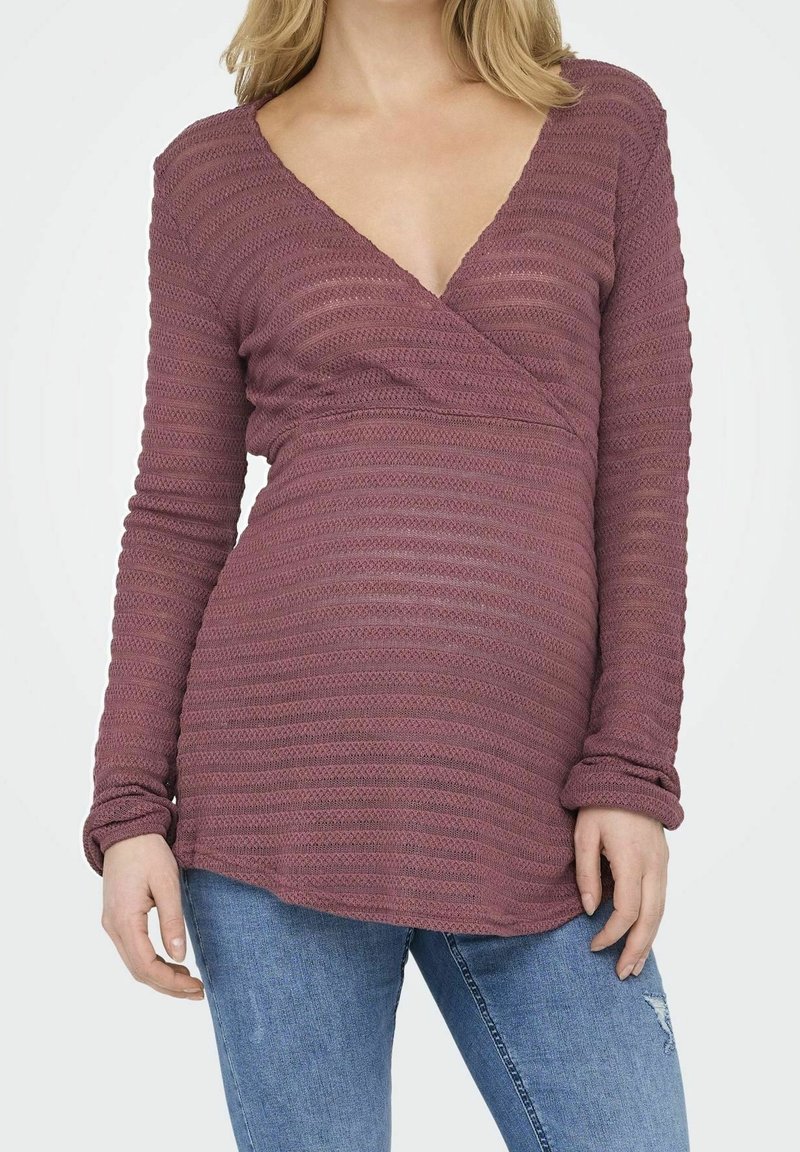 Haut à manches longues, de style portefeuille, en couleur mauve douce avec un motif rayé texturé. Caractérisé par un col en V profond et des manches amples.