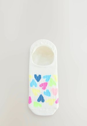 White sock with colorful heart patterns in pink, blue, green, and yellow. Ankle-length design with ribbed texture and wide opening.