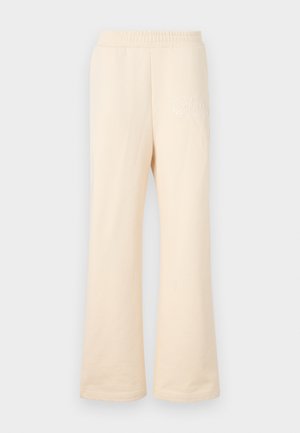 Beżowe długie spodnie dresowe wykonane z miękkiej bawełny, z elastycznym pasem i subtelnym haftowanym logo po lewej stronie z przodu.