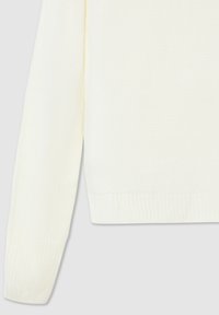 Maglione a maglia color crema con maniche lunghe, polsini e orlo a coste. Presenta un motivo testurizzato e una vestibilità rilassata.