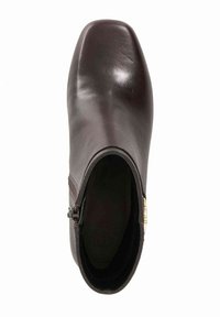 Brown leather ankle boot with a square toe, side zipper, and textured accents on the upper. Smooth surface with a seamless design.