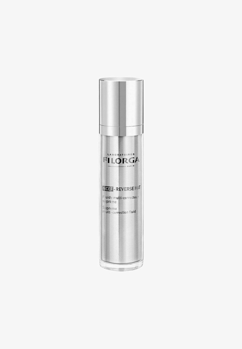 Clear glass bottle with a silver pump cap. Label includes “Laboratoires FILORGA” and product details in black text on the front.