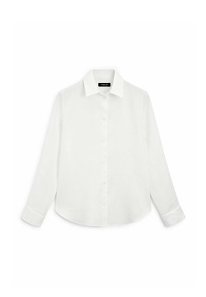 Chemise blanche à manches longues avec col, boutons sur le devant et ourlet arrondi. Fabriquée en tissu léger au toucher lisse.