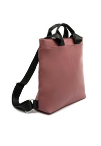 Pink synthetic tote bag with black straps, rectangular shape, and smooth texture. Features double handles and adjustable shoulder strap.