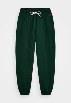 Pantalon de jogging vert foncé avec taille et poignets élastiques, cordon de serrage blanc, et petit logo rouge sur la hanche gauche.