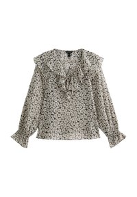 Blouse florale en noir et blanc avec col à volants et manches longues, confectionnée dans un tissu léger. Elle présente des poignets élastiqués et une coupe décontractée.
