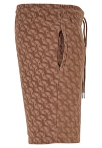 Shorts en tissu marron texturé avec ceinture élastique, poche latérale et cordon de serrage avec embouts en métal sur fond blanc.