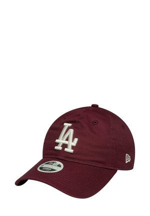 Maroon baseball cap with a white embroidered "LA" logo, curved brim, and adjustable strap. Made of textured fabric with ventilation holes.