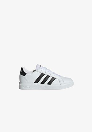 White sneaker with three black stripes, rubber sole, round toe, and lace-up design. Features a textured leather upper and branded heel.