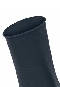 Dunkelblaue Socke mit gerippter Textur, zylindrischer Form und offenem Oberteil. Der Stoff wirkt weich und elastisch, ideal für legere Kleidung.