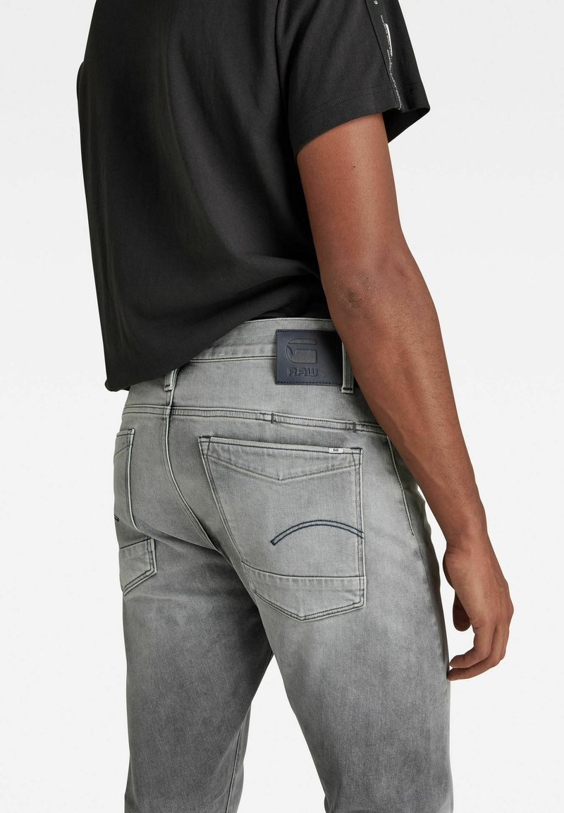 Herren Skinny Fit | G-Star SCUTAR 3D TAPERED Jeans Slim Fit sun faded glacier grey/grau - WM55904 Herren Skinny Fit | G-Star SCUTAR 3D TAPERED Jeans Slim Fit sun faded glacier grey/grau - WM55904