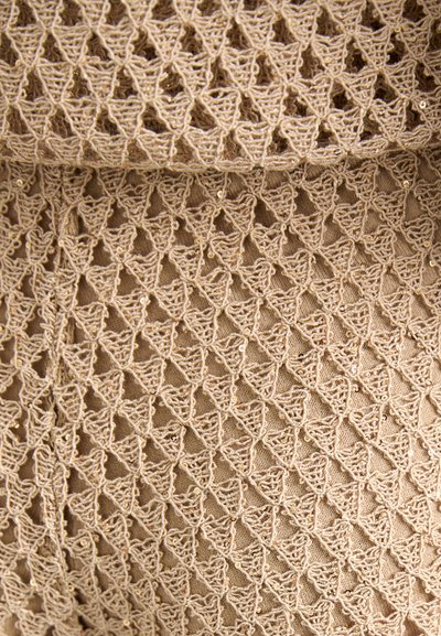 Beige fabric with a detailed lace pattern featuring diamond shapes and small sequins interspersed throughout the design.