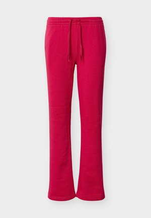 Heledat roosad paelaga dressipüksid, millel on elastne vöökoht ja sirge säärejoon, kuvatud lihtsal heledal taustal.