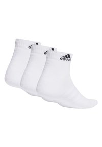 White crew socks, cotton blend, featuring black "adidas" logo on cuff, with ribbed texture and reinforced heel and toe. Pack of three.