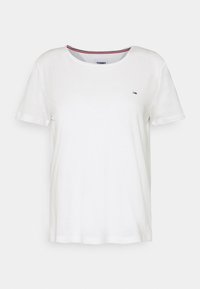 White cotton t-shirt with short sleeves, round neckline, and small embroidered logo on the chest. Smooth texture and casual fit.