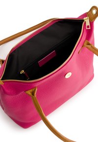 Pink textured leather handbag with brown straps, gold zipper, and black interior. Features interior pocket and decorative hardware accents.