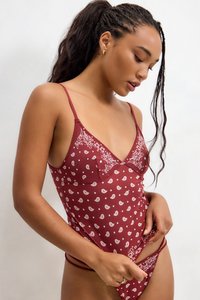 Burgundy lingerie with a floral and paisley print; V-neck design, thin straps, and a fitted cut, featuring subtle lace detailing.