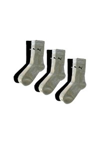 Three sets of three Puma crew socks each in black, white, and gray, arranged side by side against a white background.