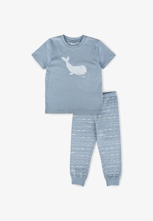 Ensemble de pyjama pour enfants bleu avec un motif de baleine souriante sur le haut et des motifs de vagues sur le pantalon.