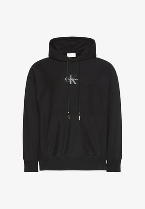 Felpa nera con cappuccio con coulisse, tasca a marsupio frontale e dettagli del logo argento sul petto. Realizzata in tessuto morbido e strutturato.