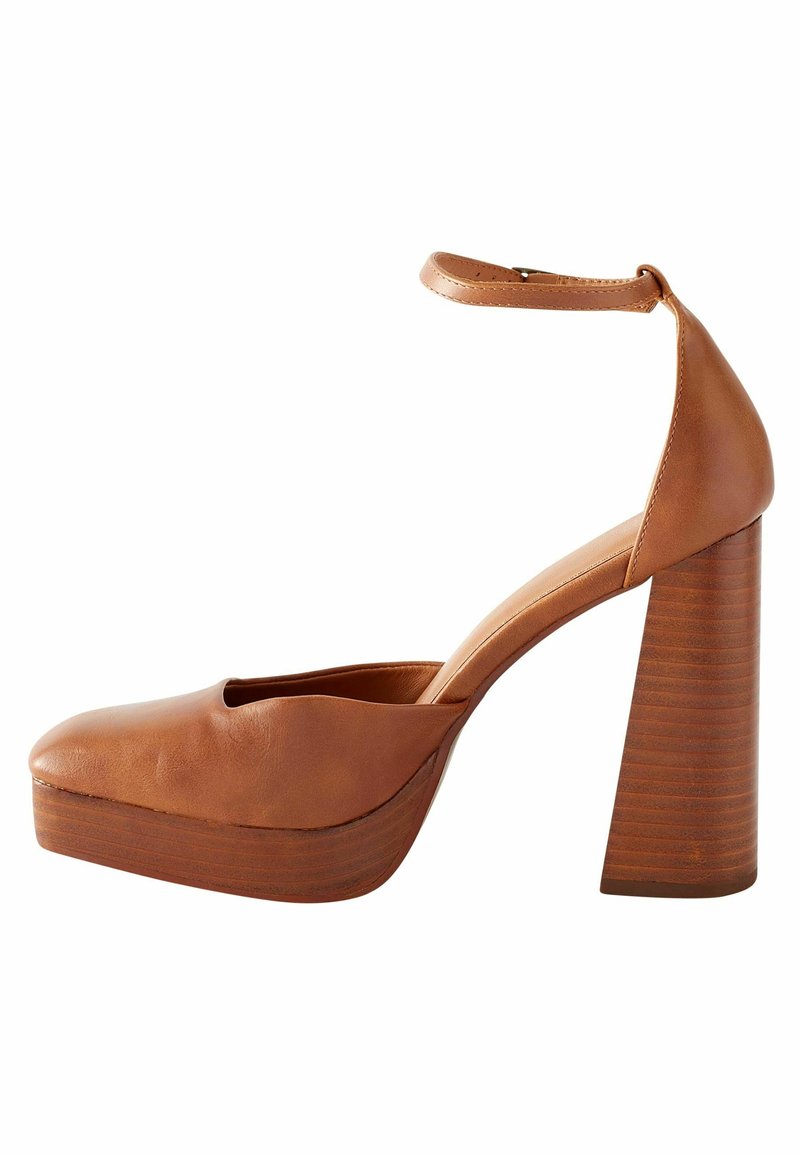 Brown leather high-heeled shoes with a peep-toe design, thick block heel, and ankle strap. The sole has a subtle horizontal texture.