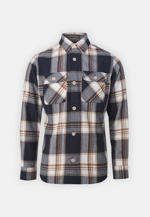 Men's plaid shirt in navy, grey, and white with brown accents. Features buttoned front, two chest pockets, and a collared neck.