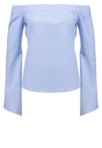 Bluzka bez ramiączek w jasnoniebieskim kolorze z bawełny. Posiada długie rękawy z szerokim mankietem i marszczonym dekoltem. Gładka, jednolita faktura.