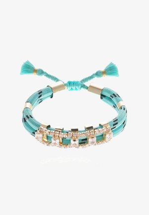 Bracelet ajustable avec du nylon tressé turquoise, des accents en métal doré et des pierres rectangulaires transparentes intégrées en rangée.