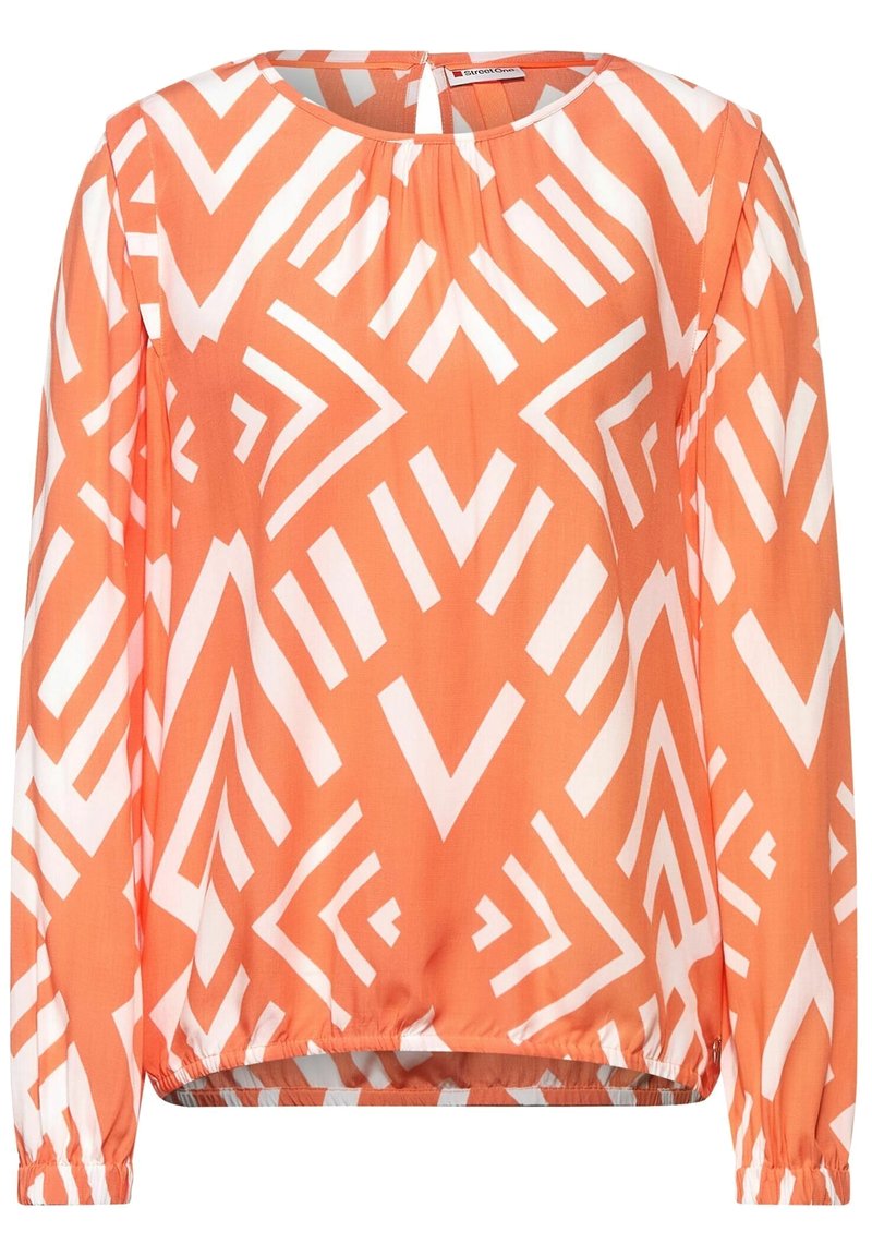 Long-sleeve blouse in coral with white geometric pattern, featuring a round neckline and gathered hemline for a relaxed fit.