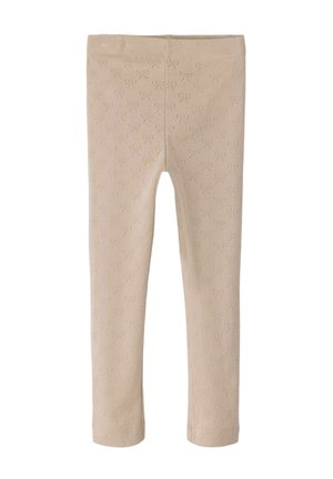 Beige leggings made of soft fabric featuring a textured pattern of small hearts. Designed with a stretchy waistband for comfort.
