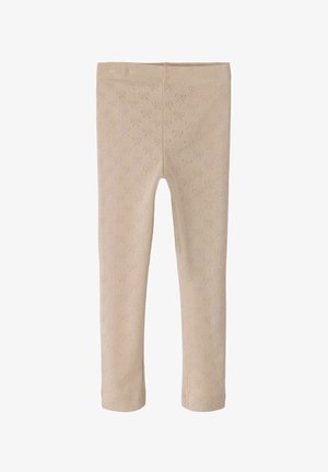 Beige leggings made of soft fabric featuring a textured pattern of small hearts. Designed with a stretchy waistband for comfort.