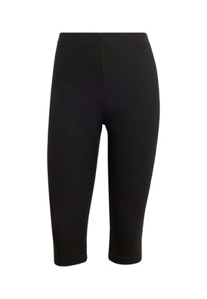 Leggings capri pretas com textura suave, design justo e cintura elástica. Apresentam um logótipo discreto perto da anca esquerda.