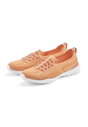 Peach-colored athletic shoes with a knitted upper, mesh detailing, elastic laces, and a white rubber sole. Flat heel with back pull tab.